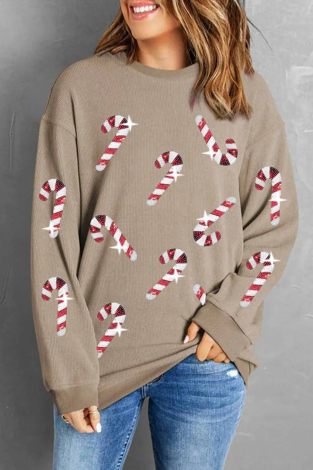 Festive holiday sweater with candy cane print, cozy and trendy for winter occasions