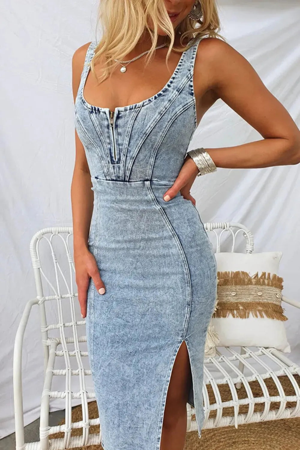 Women's denim midi dress with front zipper, side slit, and fitted silhouette for trendy casual style