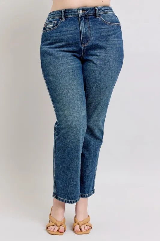 Women's high-waisted straight leg jeans with cropped hem, paired with tan sandals for casual style.