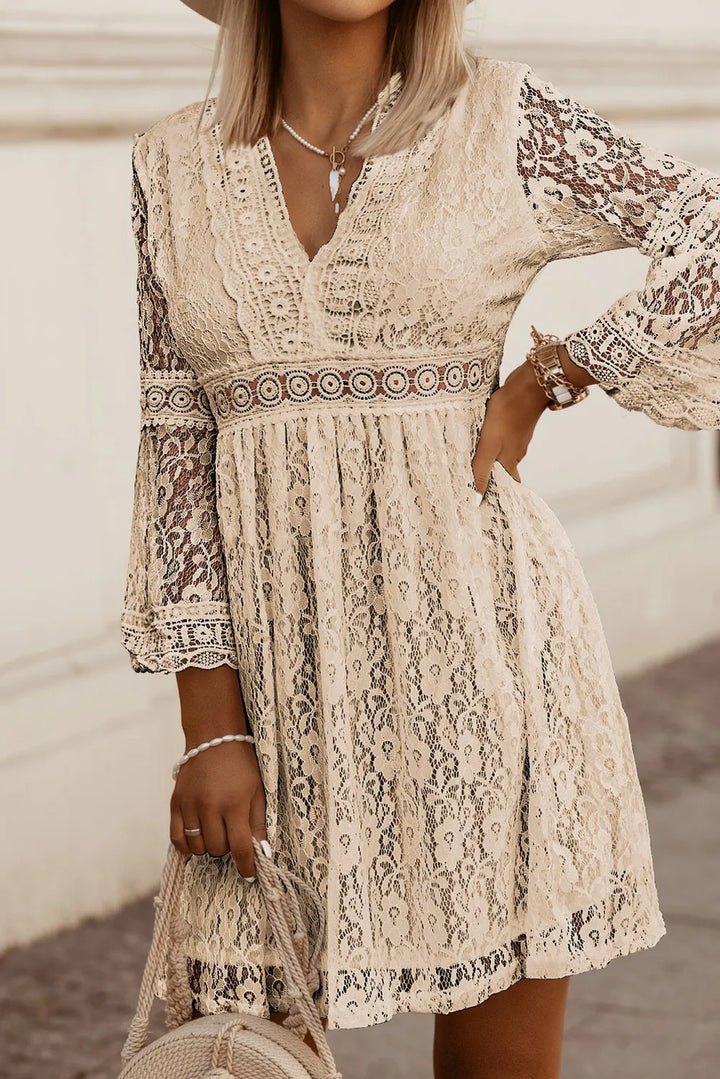 Cream lace boho dress with bell sleeves, V-neck, and floral pattern, perfect for summer outings