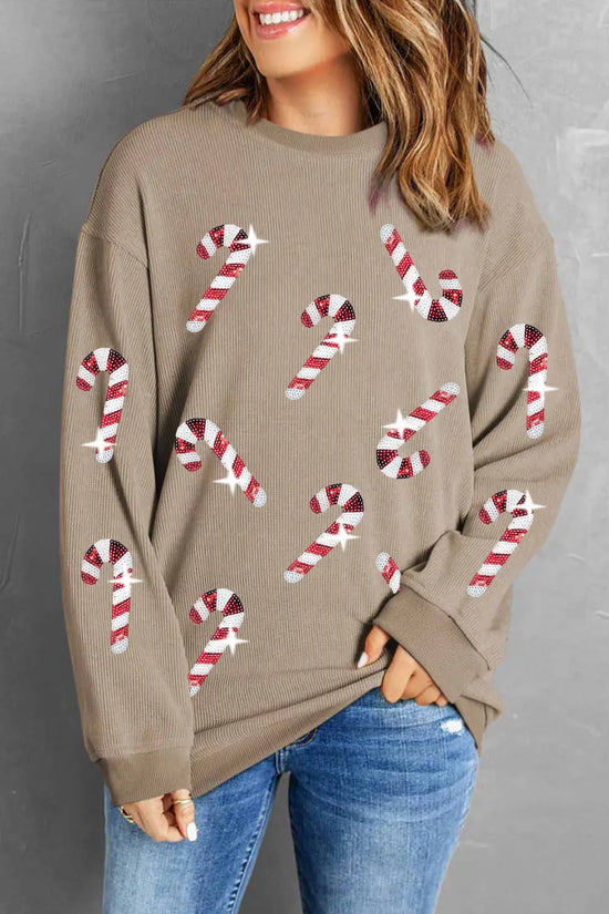 Festive holiday sweater with candy cane print, cozy and trendy for winter occasions