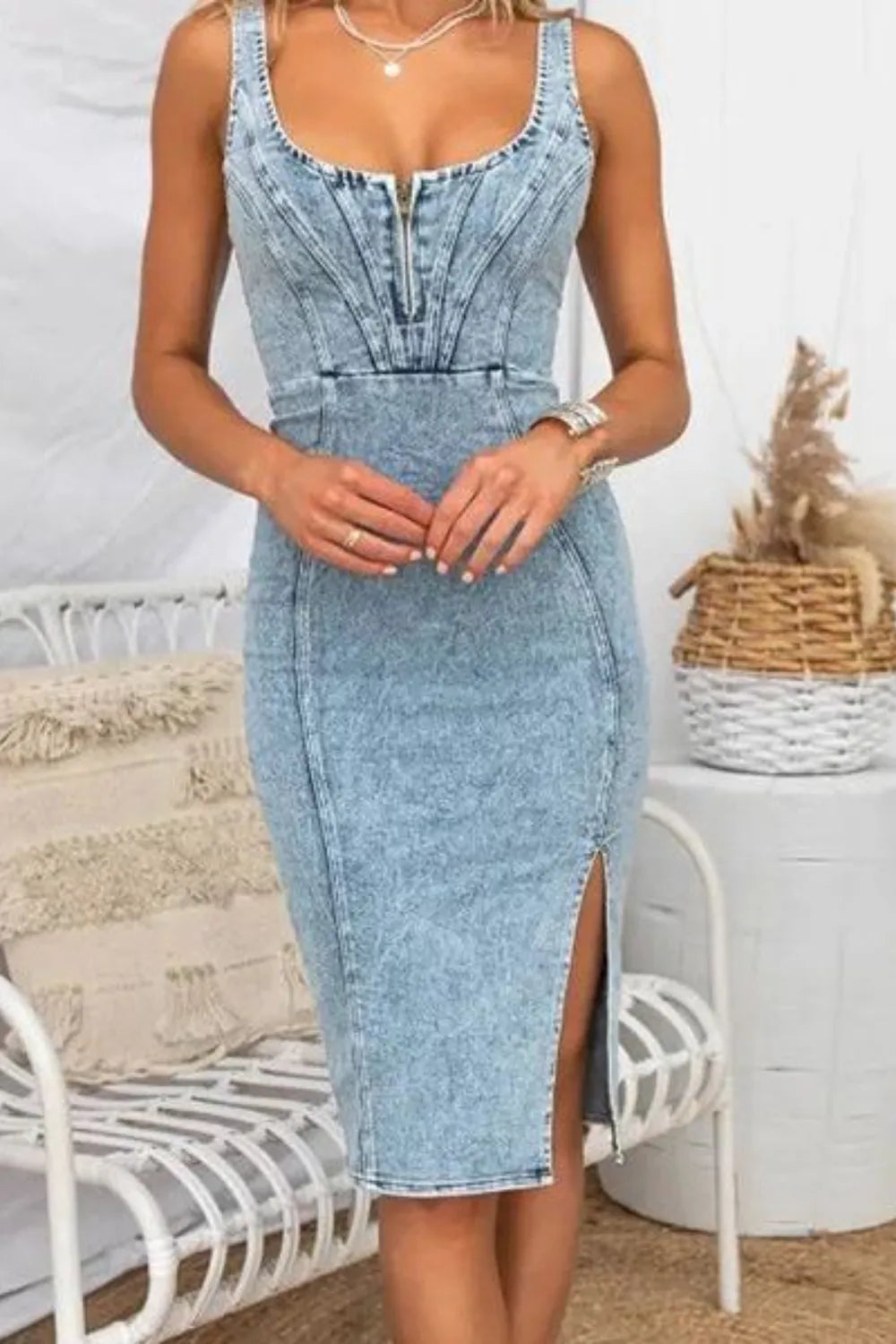 Light blue denim midi dress with front slit and zipper detail, perfect for trendy women's fashion.