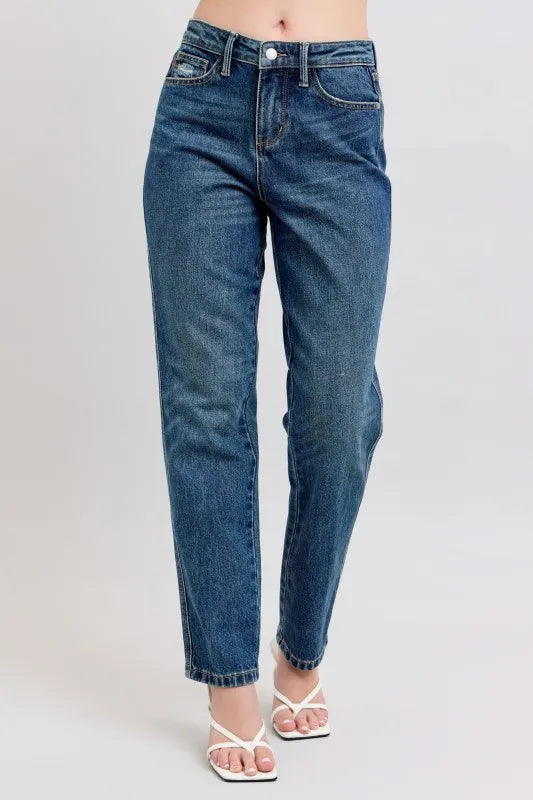 Women's high-waisted straight leg jeans with white sandals, trendy denim fashion
