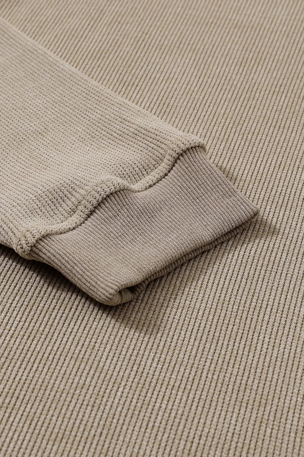 Beige ribbed knit sweater sleeve detail, soft texture, cozy women's fashion top