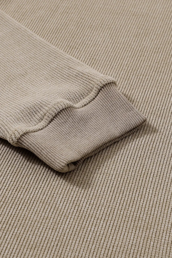 Beige ribbed knit sweater sleeve detail, soft texture, cozy women's fashion top