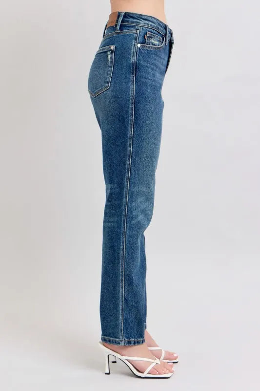 Women's high-waisted straight leg jeans with white heeled sandals, trendy denim fashion