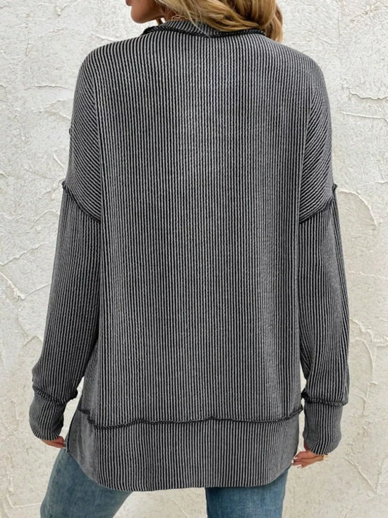Gray ribbed long sleeve top with relaxed fit, back view, paired with jeans for casual women's fashion