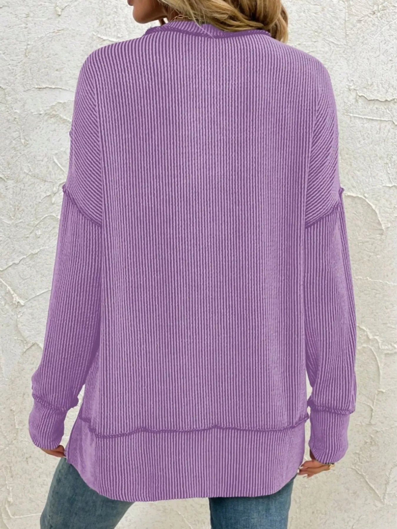Purple ribbed long sleeve top with relaxed fit, back view